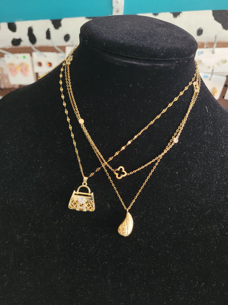 Herm inspired necklace 18k plated (purse design)