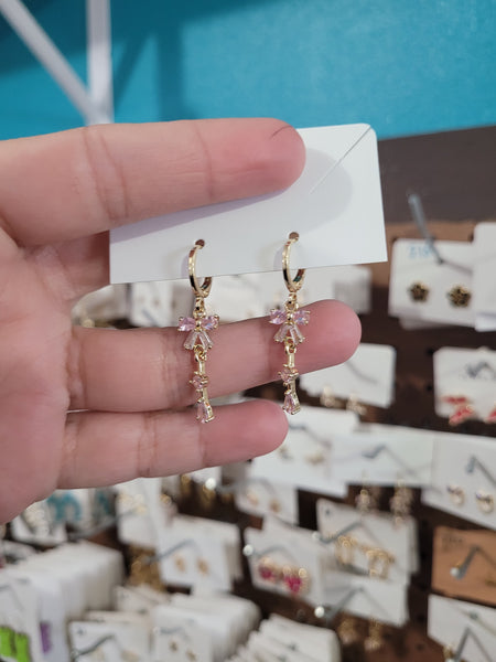 14k bow huggies #51